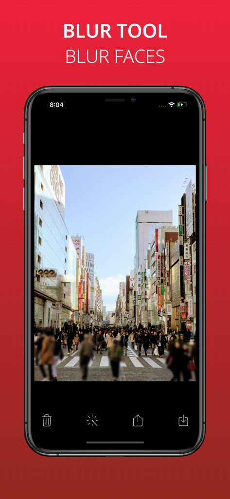 Long Exposure Slow Shutter Cam - A smartphone showing the blur tool feature used to obscure faces in a crowded urban street photo.
