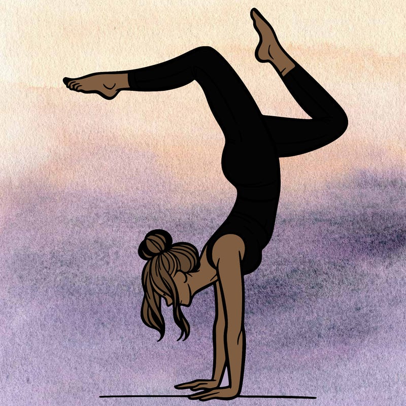 a woman doing a handstand