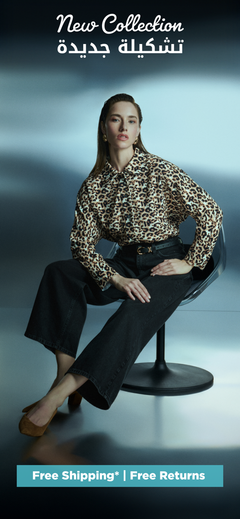 A woman wearing a leopard print shirt and black pants showcasing the Splash Online new fashion collection