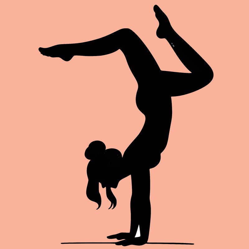 a woman doing a handstand