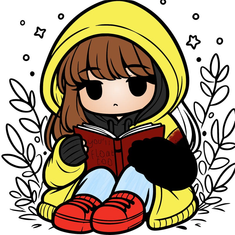 girl in oversized hoodie reading a book