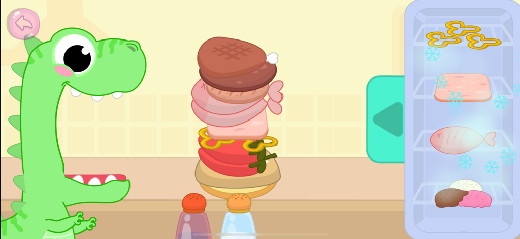 Kids Cooking Games for Toddler - Um dinossauro de desenho animado verde esperando para ser alimentado com uma pilha alta de comida em um aplicativo de culinária para bebês