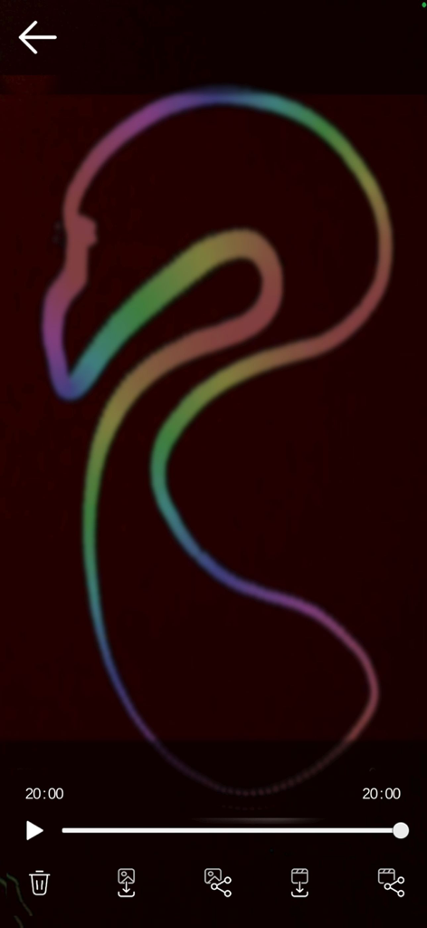 A rainbow colored light painting of a flamingo shape on a dark background in the app editor