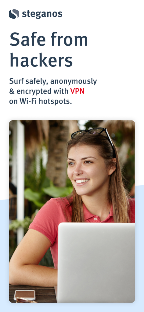 Steganos VPN Online Shield - A woman using a laptop at a cafe with Steganos VPN Online Shield for secure browsing on public Wi-Fi