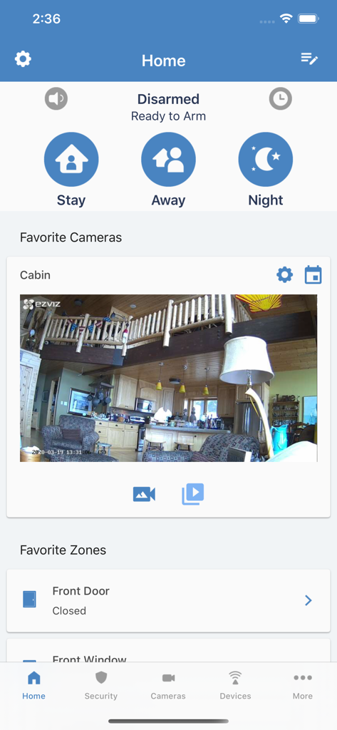 Alula Security mobile app interface showing system status camera feed and favorite home zones