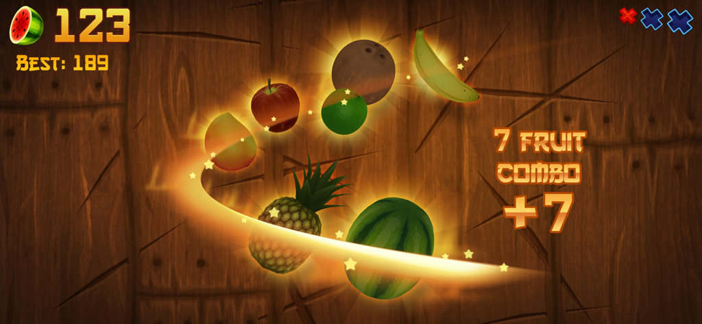 Fruit Ninja gameplay showing a seven fruit combo with a glowing golden blade slice