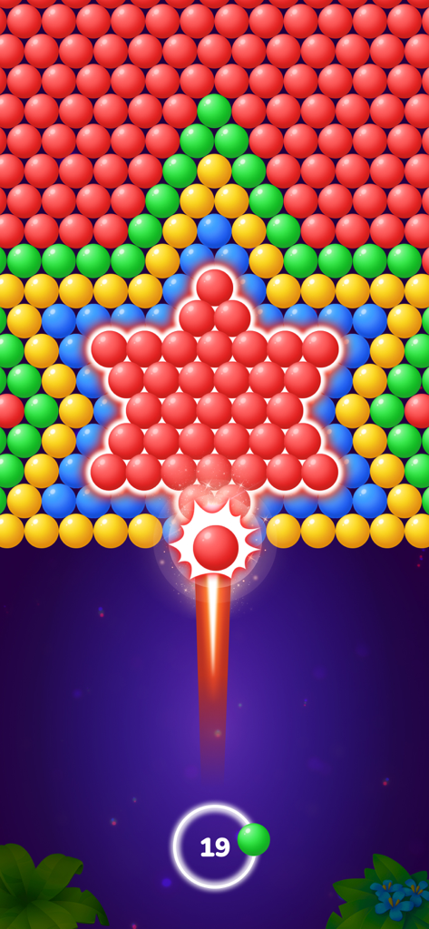 Jugabilidad de Bubble Shooter Tale mostrando una burbuja roja lanzada contra un patrón en forma de estrella de burbujas de colores