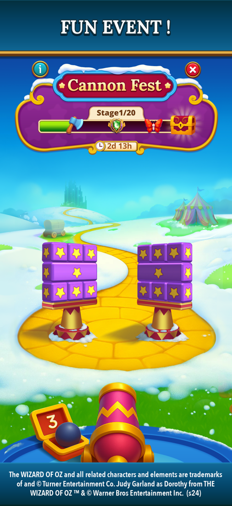 The Wizard of Oz Magic Match 3 - A screenshot of the Cannon Fest fun event in The Wizard of Oz Magic Match 3 mobile game featuring a cannon on the Yellow Brick Road.