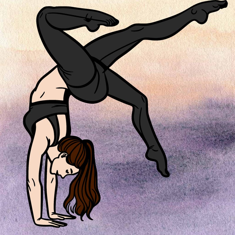 a woman doing a handstand