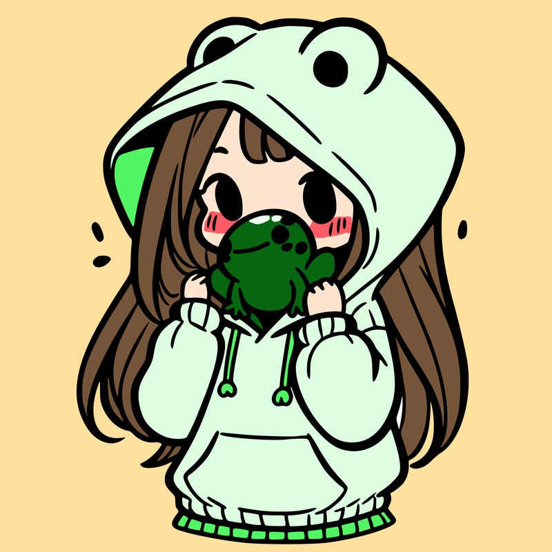 a girl holding a froggy hoodie