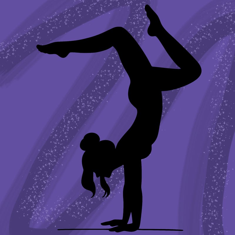 a woman doing a handstand