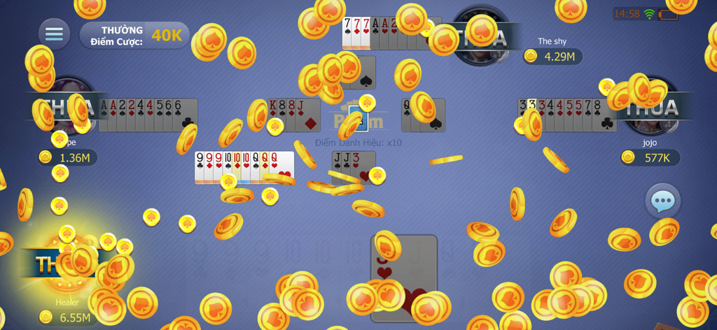 phom - A winning screen in the Phom card game with many gold coins flying across the interface