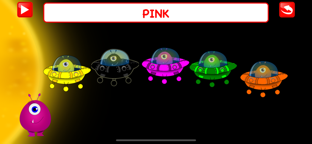 A kindergarten learning game screen showing colorful alien spaceships and the word pink.