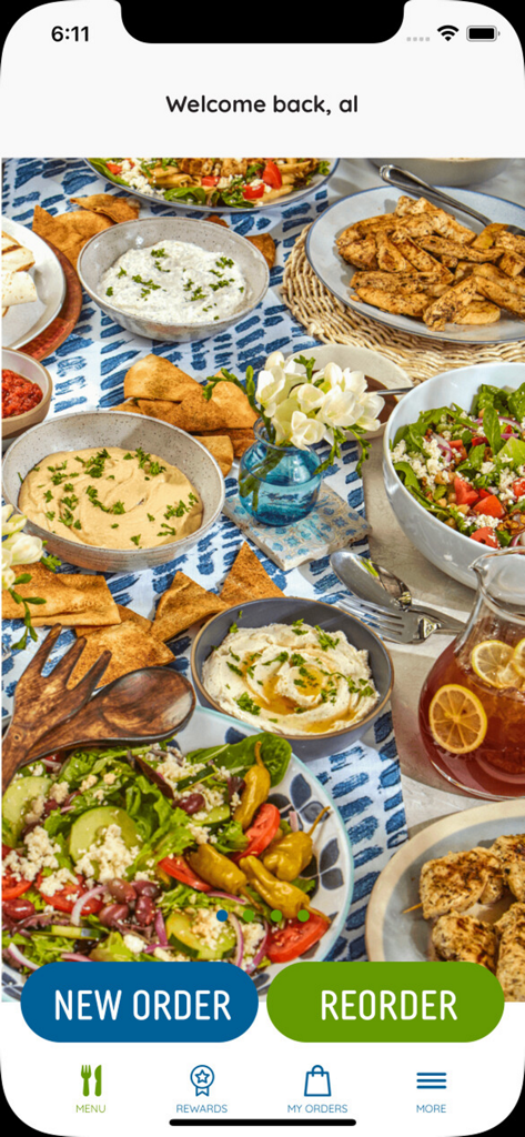 Schermata principale dell'app mobile Tazikis Cafe con piatti della cucina mediterranea in primo piano e pulsanti di ordinazione.