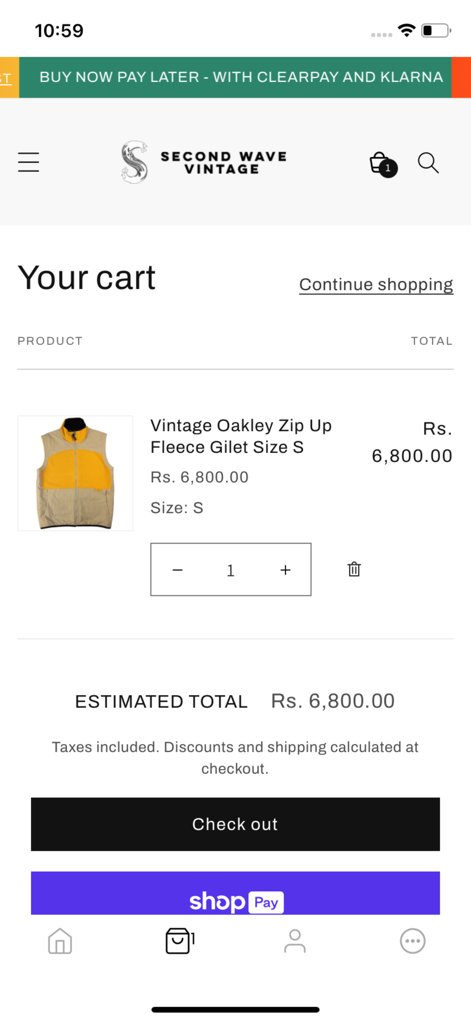 Second Wave Vintage - The shopping cart page of the Second Wave Vintage app displaying a vintage Oakley fleece gilet with checkout options.
