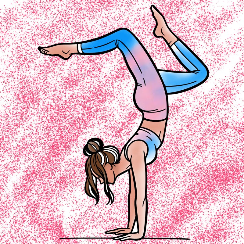 a woman doing a handstand