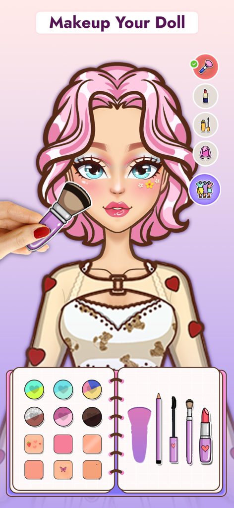 Una muñeca de papel digital con cabello rosa recibiendo un cambio de imagen de maquillaje usando un pincel y una paleta colorida de un álbum de recortes
