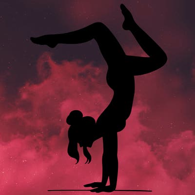 a woman doing a handstand