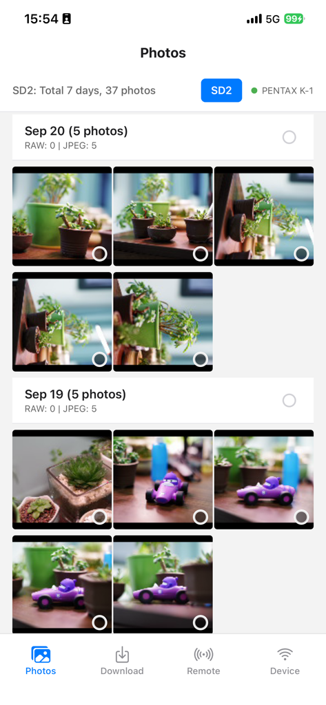 Smart Photo Sync - Smart Photo Sync app displaying a gallery of photos organized by date from a Pentax K-1 camera