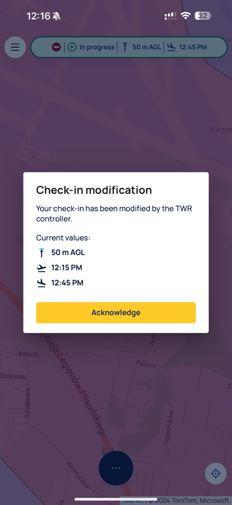 Screenshot of the DroneTower app showing a notification for a check-in modification issued by an air traffic controller over a map interface.