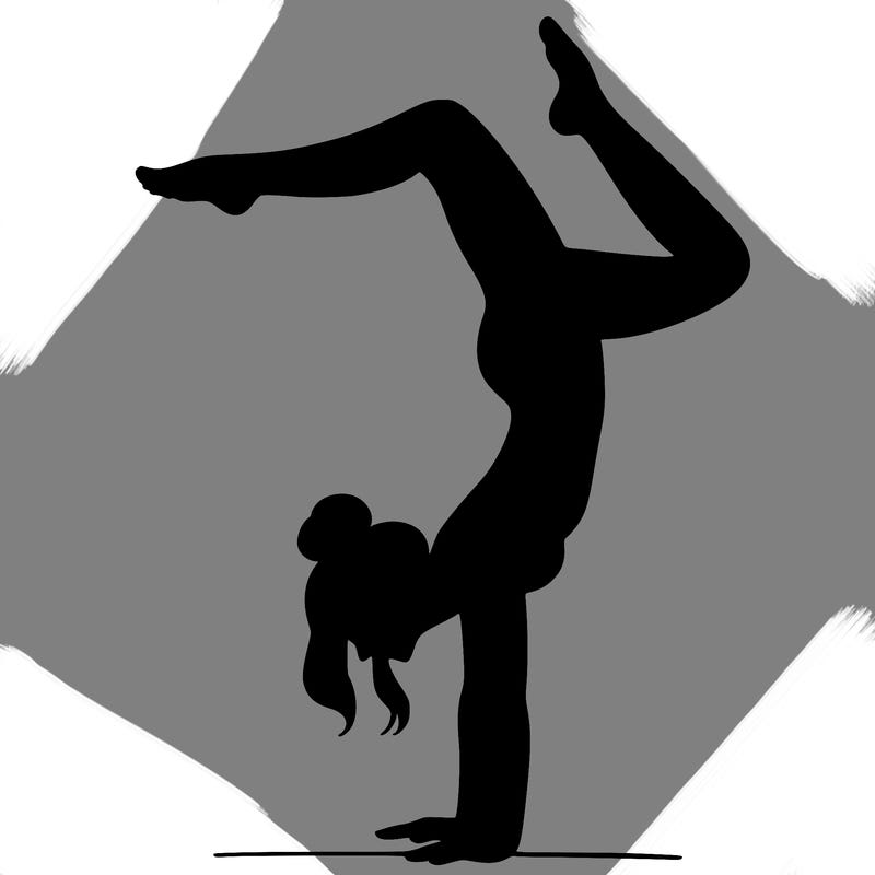 a woman doing a handstand