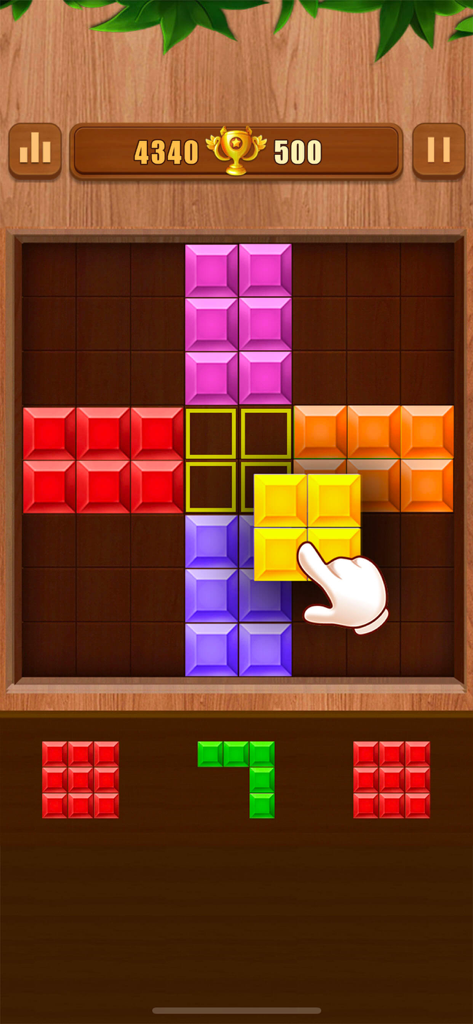 Block Puzzle : Block Blast - Capture d'écran du gameplay de Block Puzzle Block Blast montrant une main faisant glisser un bloc carré jaune sur une grille