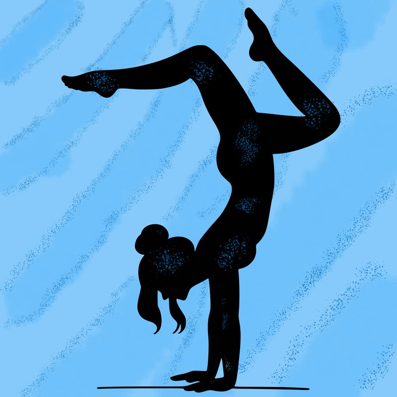 a woman doing a handstand