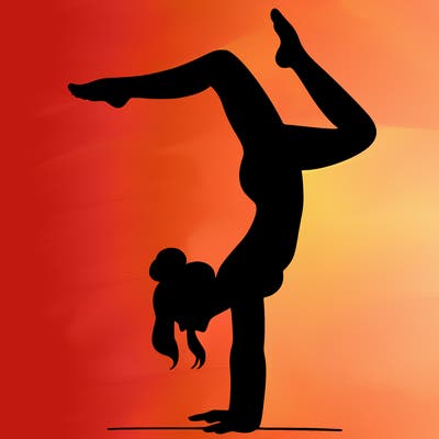 a woman doing a handstand