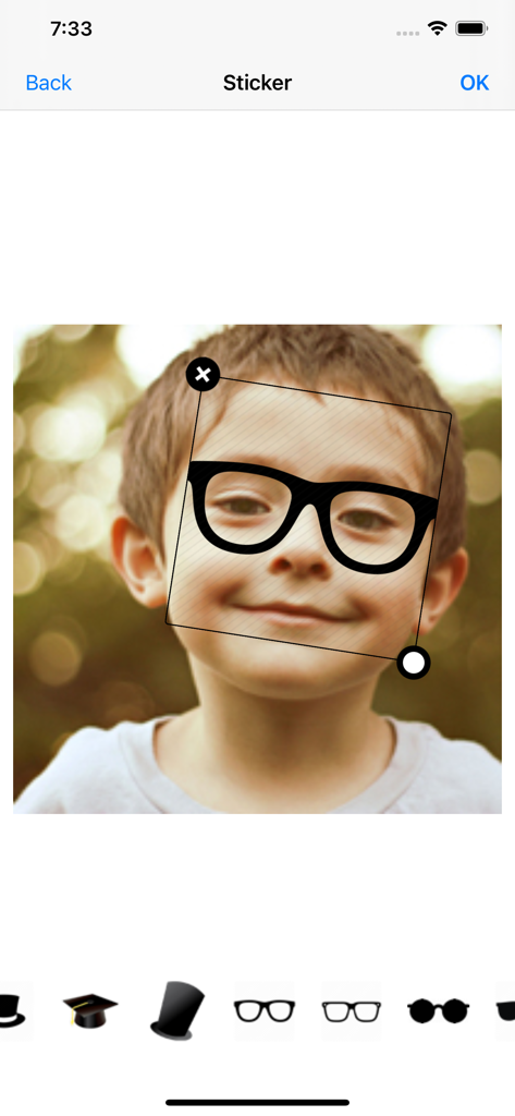Aviary: Photo Editor, Airbrush - Interface of Aviary Photo Editor showing a user adding a glasses sticker to a photo of a child