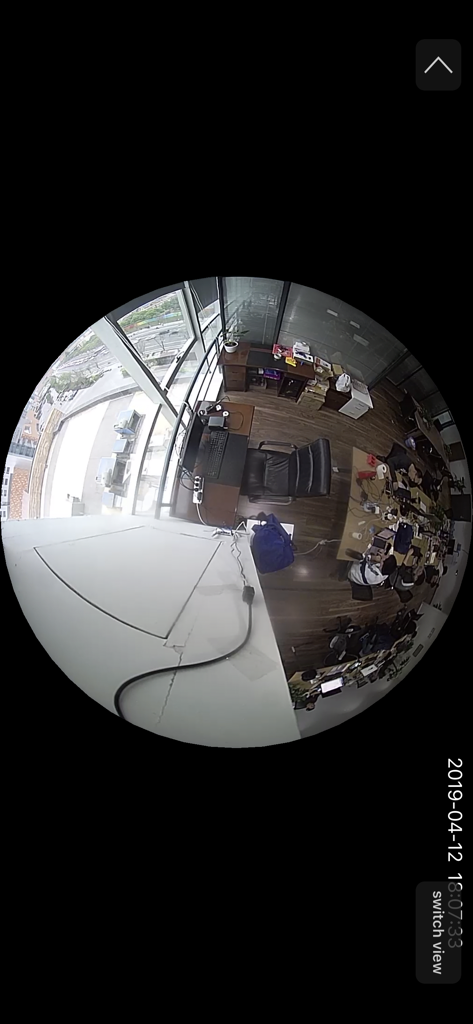 CamHi - A fisheye lens view of an office workspace from a CamHi security camera.