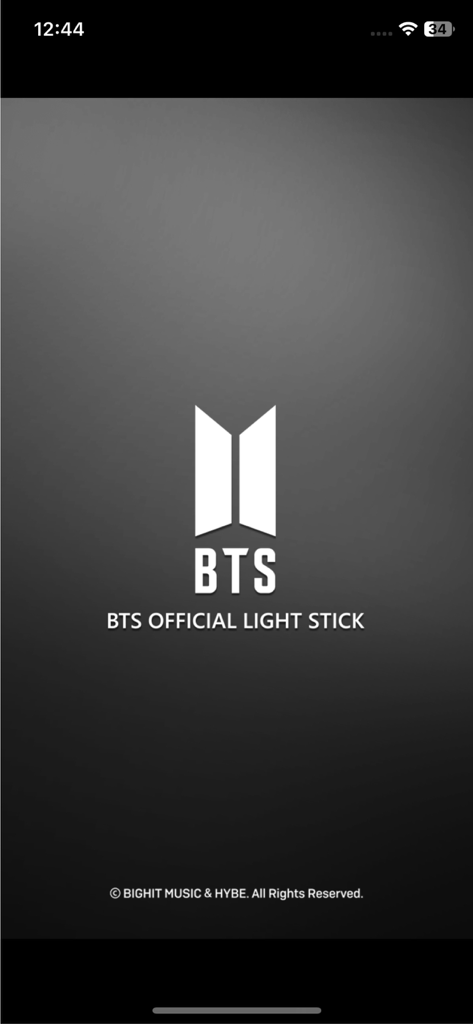 Splash screen of the BTS Official Light Stick app featuring the BTS logo and title