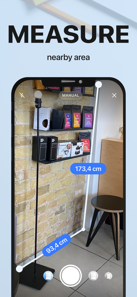 Smartphone screen using xScan app to measure nearby objects with augmented reality