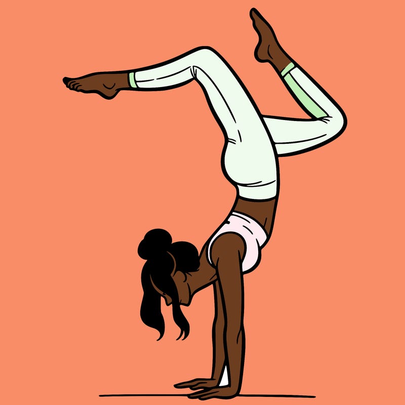 a woman doing a handstand