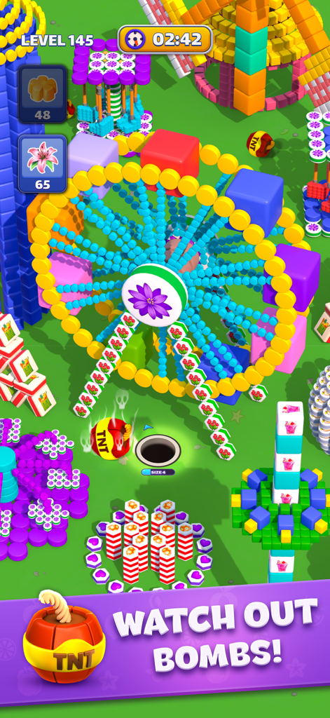 A colorful gameplay level in Tiles In Hole Black Hole with a black hole and TNT bombs.