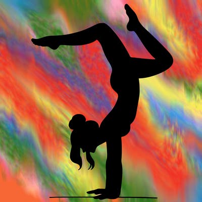 a woman doing a handstand