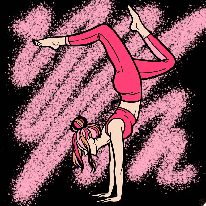 a woman doing a handstand