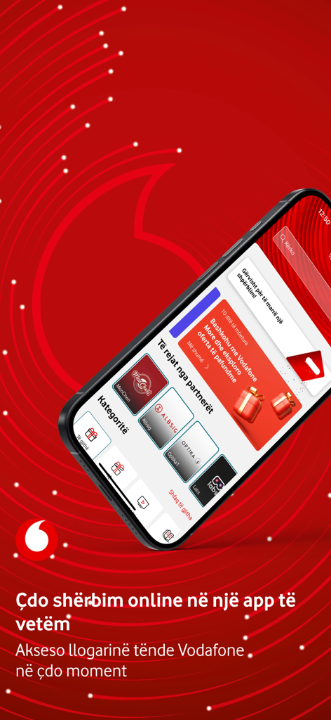 Um smartphone exibindo a interface do aplicativo My Vodafone Albânia com ofertas de parceiros e categorias de serviços em um fundo vermelho
