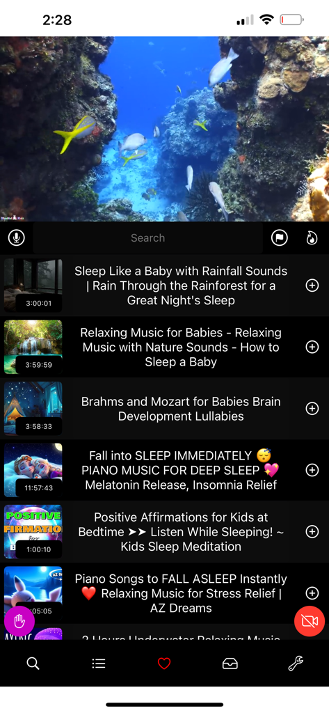 BluePlayer app interface featuring an underwater video player and a list of sleep and relaxation music results