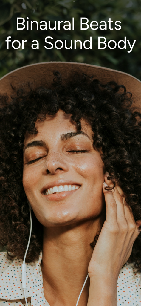 A smiling woman relaxing while listening to binaural beats through earphones