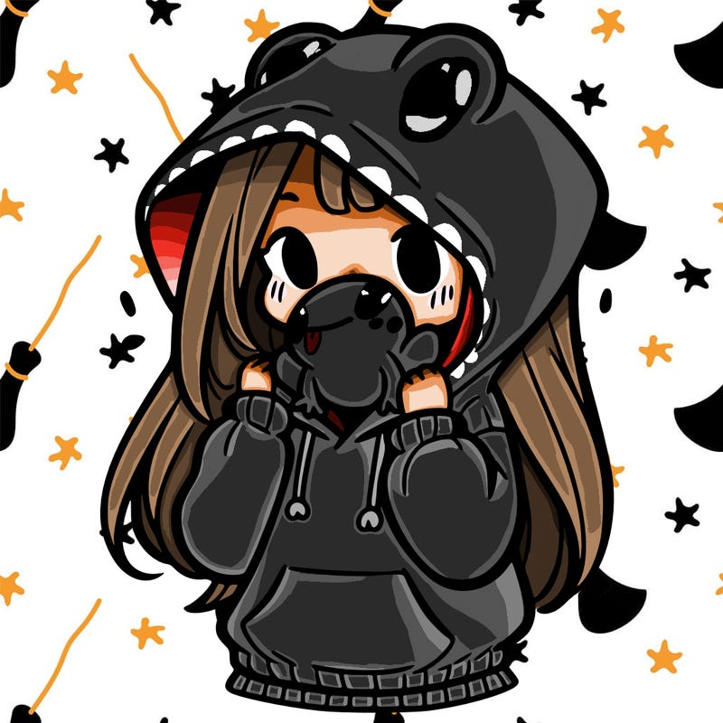 a girl holding a froggy hoodie