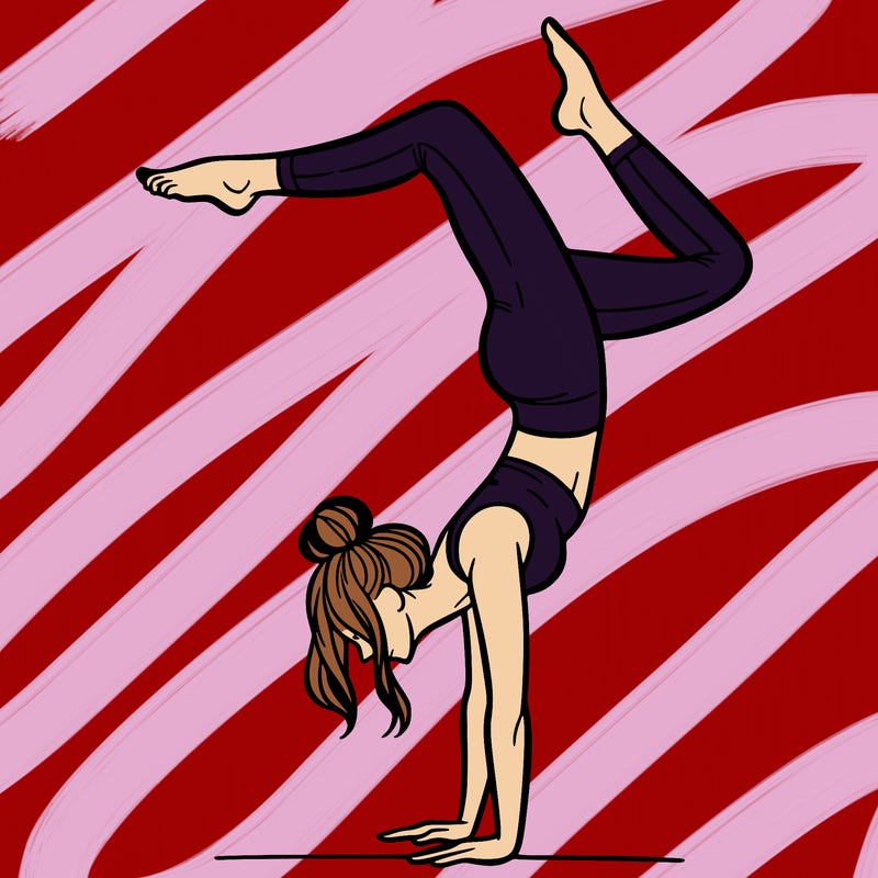 a woman doing a handstand