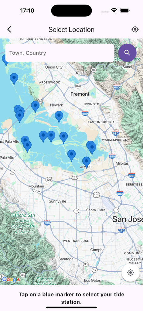 A map interface in the Tide Clock app showing various tide station locations marked with blue pins.