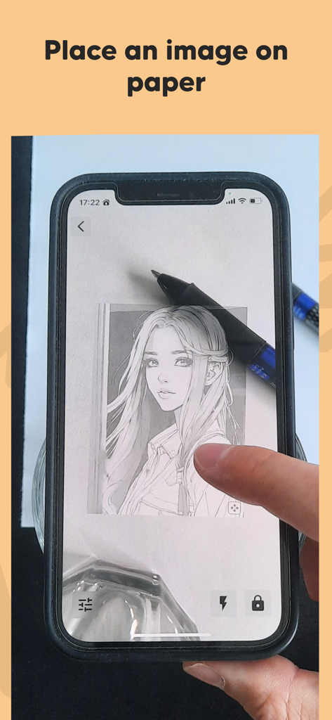 AR Draw: Trace & Sketch Master - Smartphone using augmented reality to project a drawing onto paper for tracing.