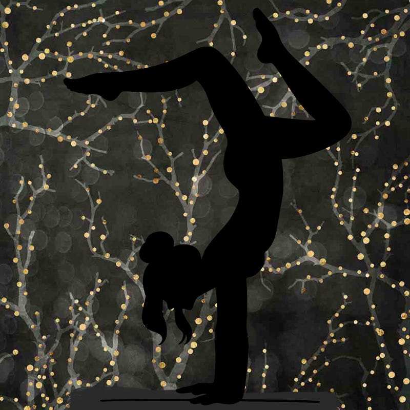 a woman doing a handstand