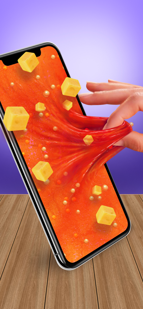 A hand pulling stretchy orange slime with yellow fruit charms from a smartphone screen