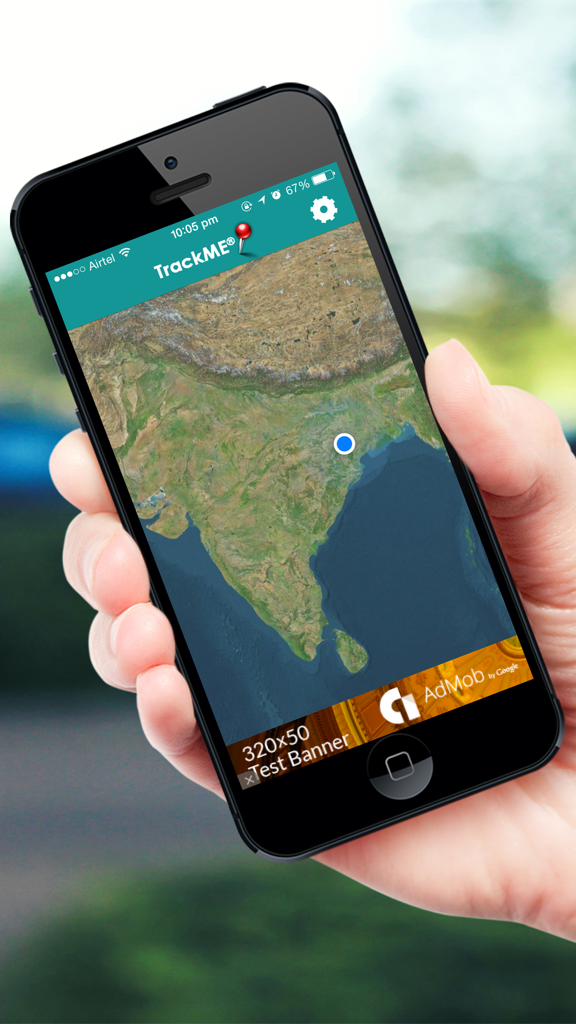 iPhone screen displaying the TrackMe app with a satellite map showing a GPS location in India