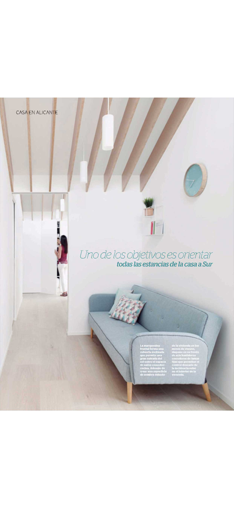 Casa Viva - Minimalist living room with blue sofa and wooden slatted ceiling from Casa Viva magazine