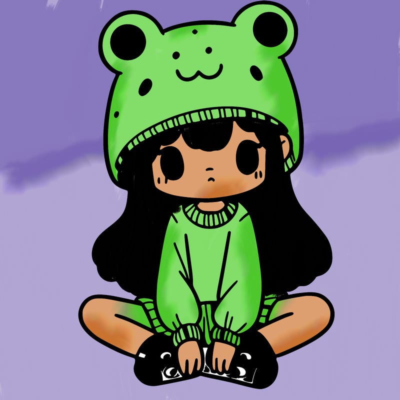 a girl wearing a frog hat and some frog socks