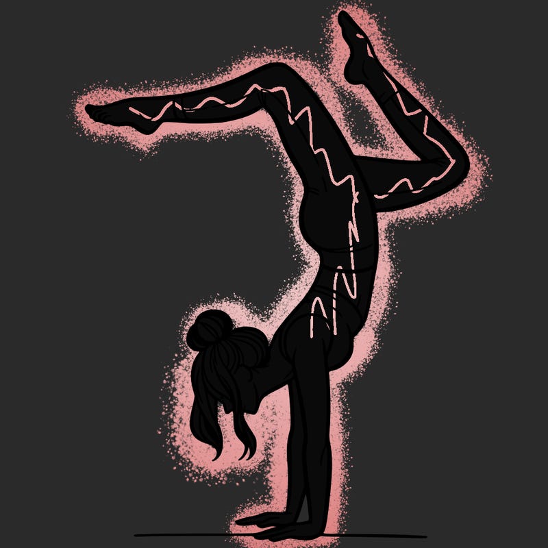 a woman doing a handstand