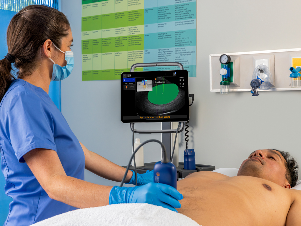 Kosmos Ultrasound 4.0 - A clinician uses the Kosmos Ultrasound 4.0 app on an iPad to perform a bladder scan on a patient.